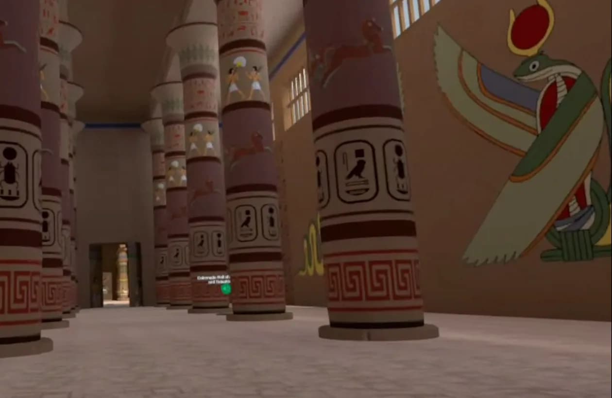 An Egyptian temple hall inside the headset: two rows of painted lotus-bud columns receding down a sunlit aisle, a winged-goddess mural on the right wall.